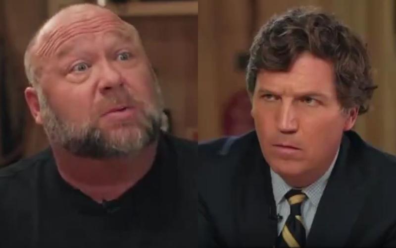 Watch Tucker Carlson Maintain a Straight Face as Alex Jones Claims Biden Attacks Dogs and ‘Wanders Around the White House Totally Naked’