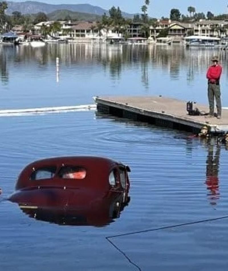 Man Watches Classic Car Sink in Lake