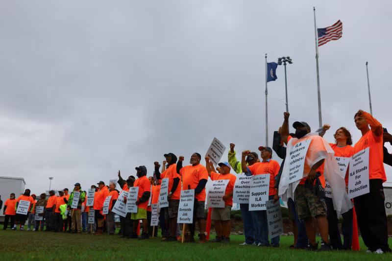 White House sides with union as dockworker strike enters second day