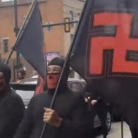 Masked group marches through Ohio neighborhood with swastika flags