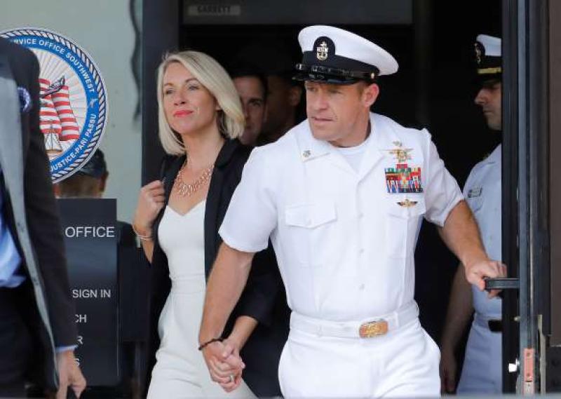 U.S. Navy SEAL demoted for posing with dead prisoner