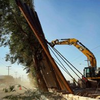 Parts of a new California border fence weren’t yet anchored. Big winds blew them down