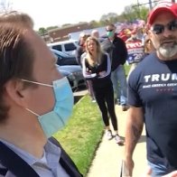 Watch protesters harass local reporter at reopening rally 