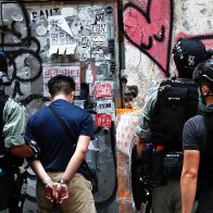 China & Hong Kong -- First Arrest Made Under New Hong Kong Security Law for Man Holding 'Independence Flag' 